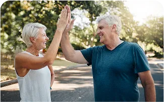 happy-senior-couple-highfive