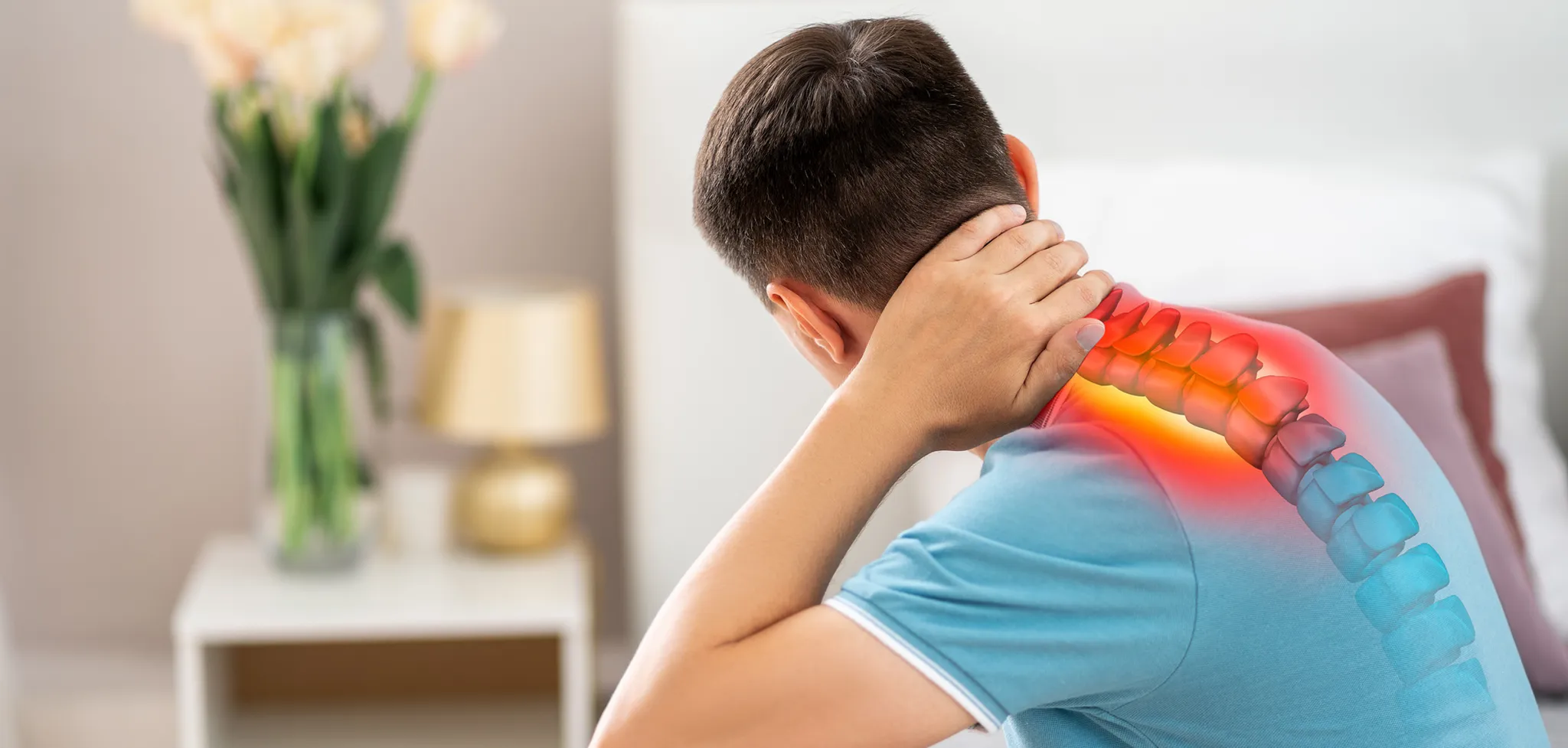 Man holding his neck showing neck pain and cervical spine discomfort highlighted in the upper back